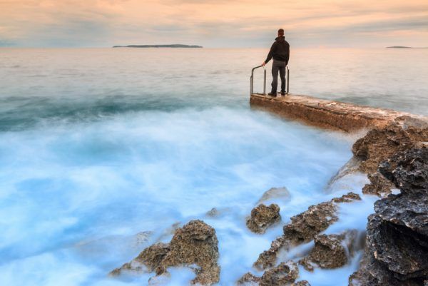 Man standing on a sea coast of Losinj island