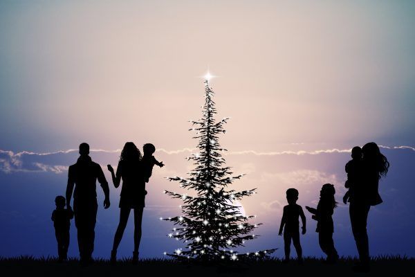 people around the Christmas tree