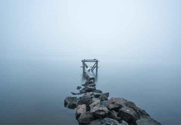 Minimalistic landscape. Fog river walkway. Long exposure shot.