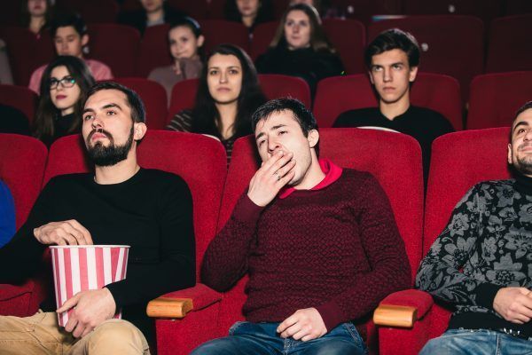The guy on the boring movie at the cinema