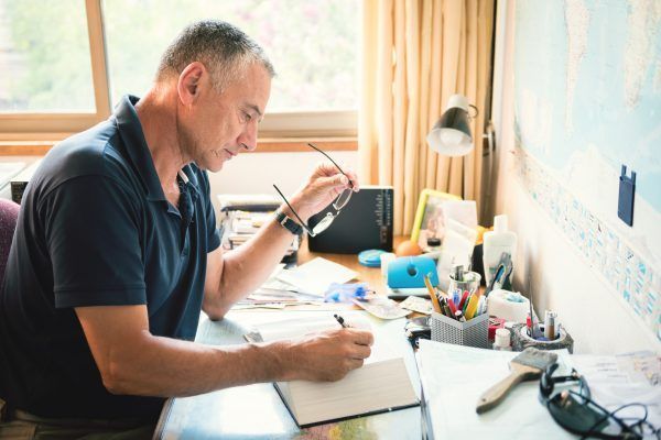 Mature Hispanic Man At Home office