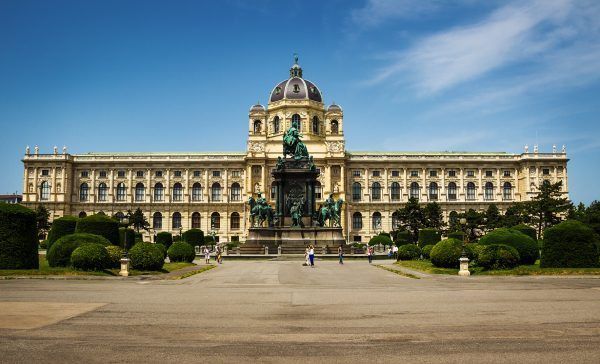 Beautiful view of famous Kunsthistorisches Museum with park and sculpture in Vienna, Austria.