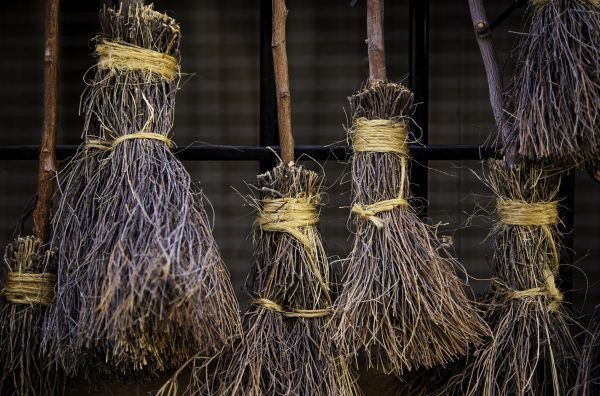 Detail of brooms for witches in halloween, detail of decoration and superstition, magic and mystery