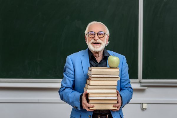 Senior confident man at school